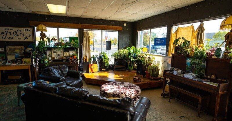 Seating area with the conspiracy wall at Black Sheep Coffee